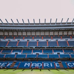 Empty stands of Santiago Bernabéu Stadium in Madrid, showcasing Real Madrid CF's seats.