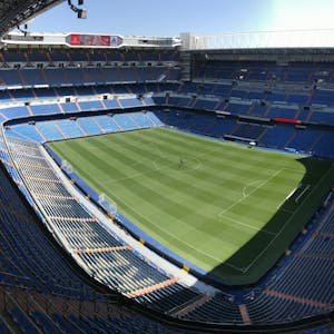 High-angle view of the empty Santiago Bernabeu Stadium on a sunny day in Madrid, Spain.